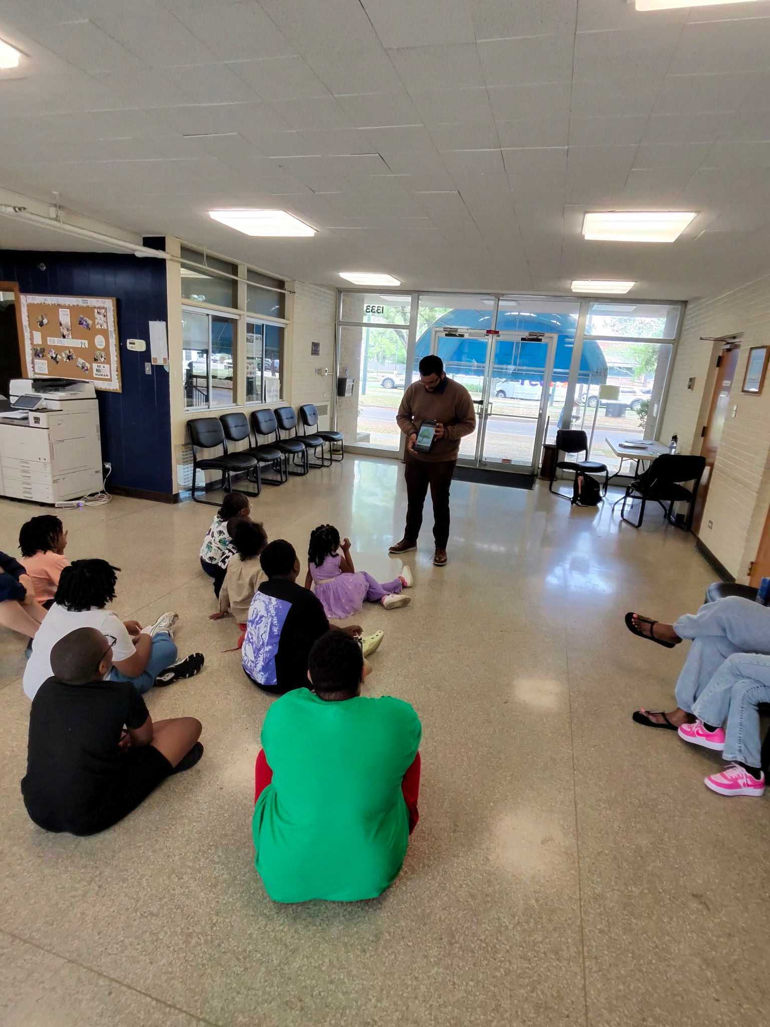 Reading to children at a community event
